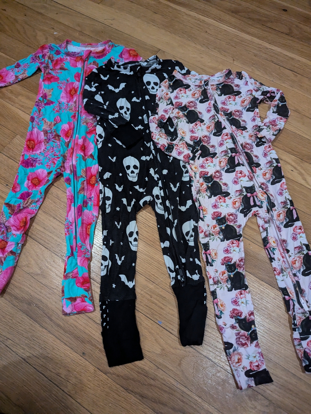 Posh Peanut Teal Floral, Black Skull, and Pink Floral One-Piece Sets